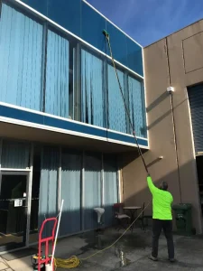 a man doing commercial window washing